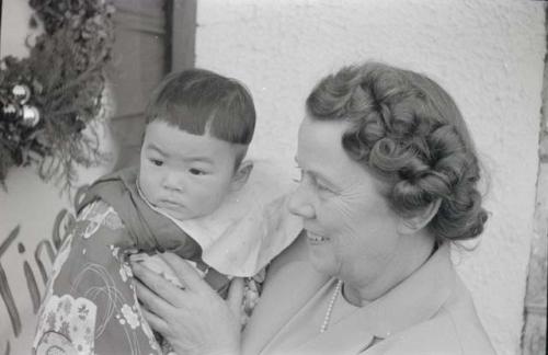 Woman holding child