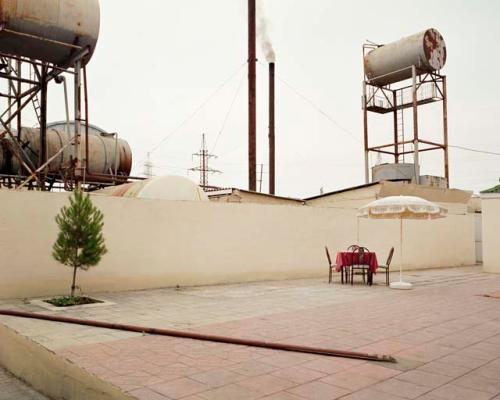 "Open-air cafe at the Shafa Sanatorium. In the 1950s, the Soviet government offered free holiday flights to sanatoriums in Naftalan housing 2,500 guests. Naftalan, Azerbaijan, 2010"