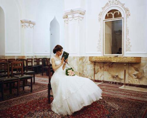 "A Zoroastrian bride poses for a photograph at the Tehran Fire Temple. Tehran, Iran, 2015"