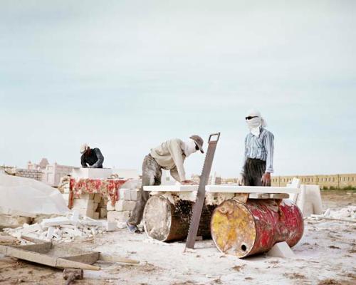 "In a cemetery on the Caspian coast, Uzbek migrant workers build elaborate mausoleums for the new, oil-rich middle class. Koshkar-Ata, Kazakhstan, 2010"