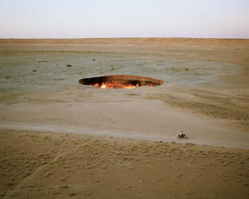 "The 'Door to Hell'. In 1971, Soviet geologists were drilling in the Turkmen desert when the land gave way beneath them, leaving a seventy-meter-wide, noxious gas-emitting crater. They ignited the gas to try to burn off the excess, but the crater has been ablaze ever since.  Darvaza, Turkmenistan, 2012"