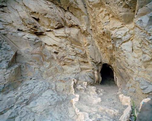 "Women who are trying to conceive make pilgrimages from all over Turkmenistan to visit the Qyz Bibi shrine. Qyz Bibi, the pagan goddess of fertility and womanhood, is believe to have lived most of her life in a cramped cave, fed through a tiny hole in the rock. Nokhur, Turkmenistan, 2012"