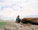 "Tarlan, an Azerbaijani shaman, plays Gaval Dash, the 'tambourine stone' in Gobustan National Park. Gobustan, Azerbaijan, 2015"