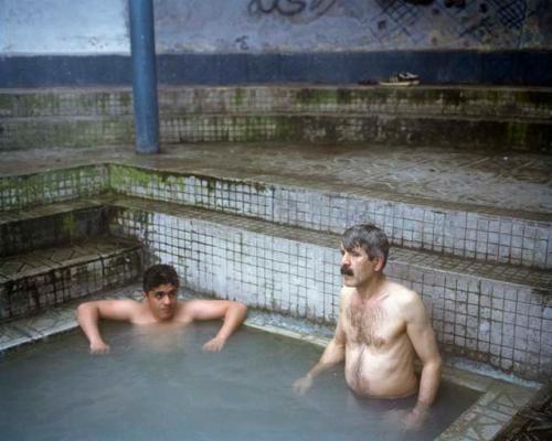 "Bathers at the Ishker hot springs. The walls around Ramsar's numerous medicinal baths were built with local stone, and the healing benefit of the water is sometimes attributed to this radioactive building material. Ramsar, Iran, 2015"