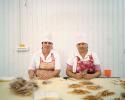 "Employees of a fish-curing factory that vacuum packs strips of dried vobla, or Caspian roach, and distributes them across Russia to be eaten as a snack with beer. Kamyzyak, Russia, 2012"