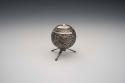 Repousse silver pepper shaker