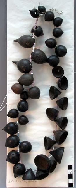 Necklace of glass beads and seeds of wiririma - some pointed and some +