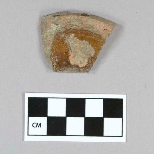 Ceramic, earthenware, redware, brown lead glazed, base sherd