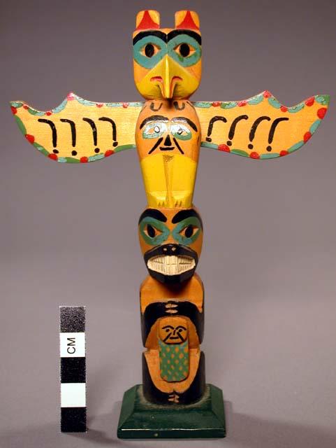 Miniature totem pole (6 1/2" high), thunderbird pole