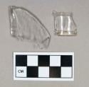 Glass, curved, clear, molded bottle body and finish, fragments