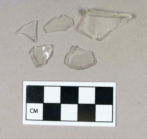 Glass, curved, clear, fragments