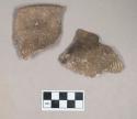 Ceramic, earthenware rim and body sherd, cord-impressed, one with possible handle attachment; two sherds crossmend