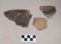 Ceramic, earthenware rim sherds, one with partial handle, two with notched rim, one with incised rim, undecorated body, shell-tempered