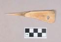 Worked animal bone awl, perforated, possibly incised