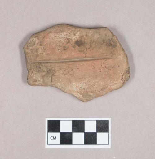 Ground stone, grooved stone fragment, possible abrading stone