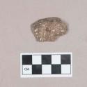 Ceramic, earthenware body sherd, grooved on both sides, possibly worked on one edge, shell-tempered