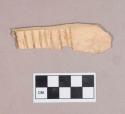 Worked animal bone, rib fragment, incised parallel lines