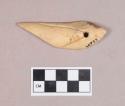 Worked animal bone fragment, perforated, incised, and worked to a point