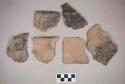 Ceramic, earthenware body and rim sherds, cord-impressed, one with handle attachment, shell-tempered; two body sherds crossmend