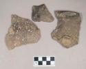 Ceramic, earthenware body, rim, and handle sherds, one cord-impressed, one cord-impressed and punctate, one incised with possible Ramie design and punctate, shell-tempered