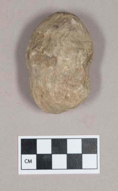 Ground stone, grooved stone, pecked groove, incised X at one end, possible plummet or pounding stone