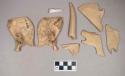 Fish bones; turtle bone fragments, one worked; worked antler tip fragments, one calcined