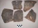 Ceramic, earthenware body, rim, and handle sherds, one rim incised above handle, undecorated body, shell-tempered; four sherds crossmend