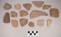 Earthenware vessel rim, body, and foot ring base sherds. Most with red painted interior and exterior. Some with white painted exterior.