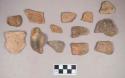 Earthenware vessel rim, and body sherds. Most with red painted exterior and interior Some with white paint exterior and red paint interior.