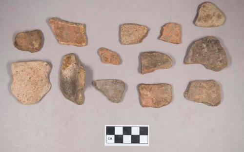 Earthenware vessel rim, and body sherds. Most with red painted exterior and interior Some with white paint exterior and red paint interior.