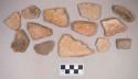 Earthenware vessel rim, body, and foot ring base sherds. Most with red painted exterior and interior. Some with white painted exterior and interior. One piece of a reddish chert flaking debitage and one unaltered stone (possibly limestone).