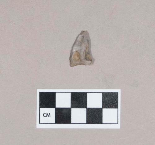 Chipped stone, unifacially worked, three worked edges, possible projectile point, triangular