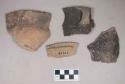 Ceramic, earthenware body, rim, and handle sherds, one cord-impressed, one with incised rim, two with incised rim above handle or lug, one with punctate body, one with incised lug, shell-tempered