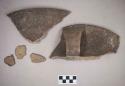 Ceramic, earthenware rim and handle sherds, incised above handle, possible cord-impressed body, shell-tempered, two sherds crossmend; earthenware body sherds, one cord-impressed, grit-tempered
