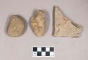 Ground stone, incised stone and stone fragments, one with fossils
