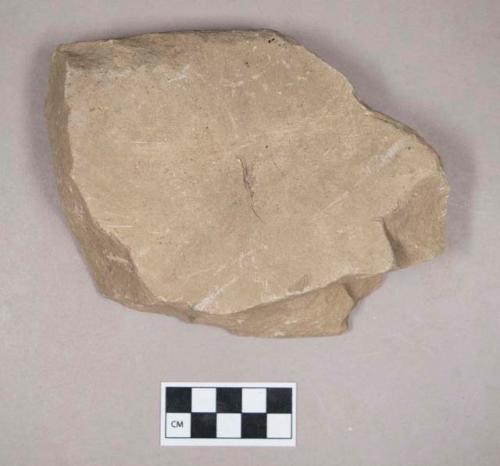 Ground stone, grooved stone fragment, grooved on both sides, possible abrading stone