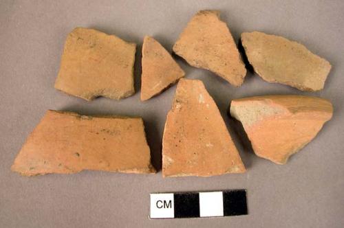 4 rim potsherds, 19 sherds, 1 base fragment - plain burnish, reddish fine ware (