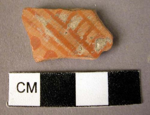 Potsherd - orange red on buff, vertical bands and ladder pattern