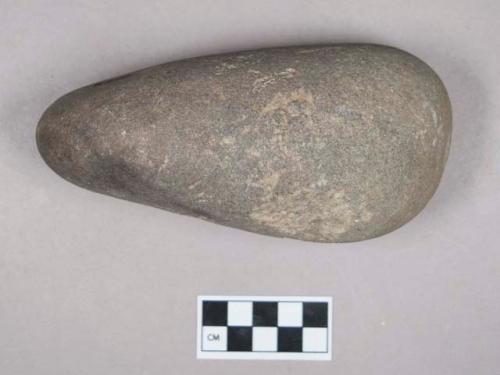 Ground stone, ovoid stone, possibly pitted on one side