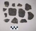 Ceramic, earthenware rim and body sherds, undecorated, exterior blackened, grit-tempered; two rim sherds crossmend; two body sherds crossmend