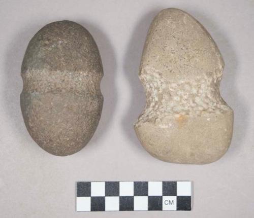 Ground stone, grooved maul, tapered end, and one grooved stone with an incised "x" on each end