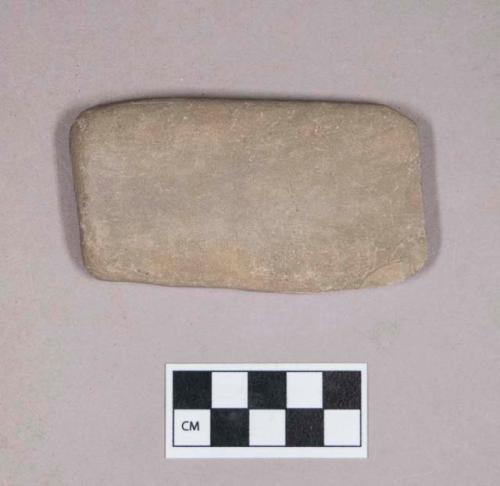 Ground stone, flat rectangular stone, smoothed on one side, possible abrading stone