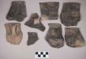 Ceramic, earthenware rim and handle sherds, three missing handles, one complete handle, incised rim above handle, undecorated, shell-tempered; earthenware rim and handle sherd, incised above im, punctate shoulder, cord-impressed body, shell-tempered; seven sherds crossmend
