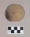 Ceramic, earthenware disk, worked from body sherd, cord-impressed, shell-tempered