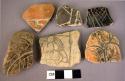 Incised body sherds.  Includes black, orange and cream wares.  7 pieces