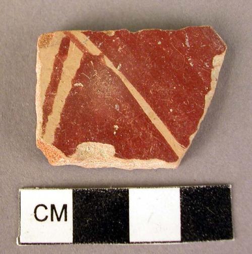 Body sherd.  Red on cream.  Micaceous paste.