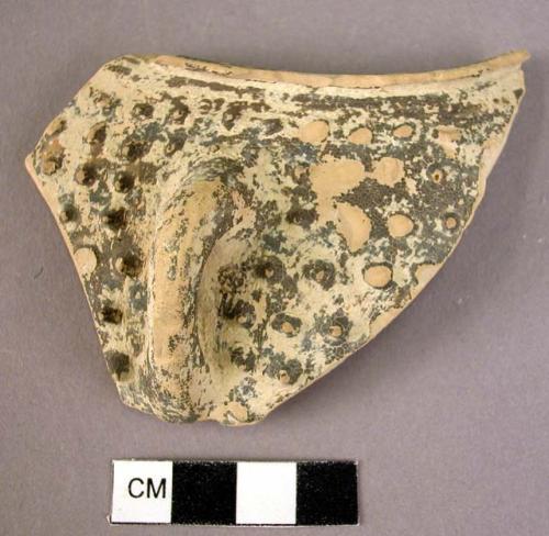 Rim potsherd with handle