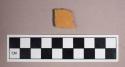 Ceramic, earthenware, redware body sherd with light brown glaze