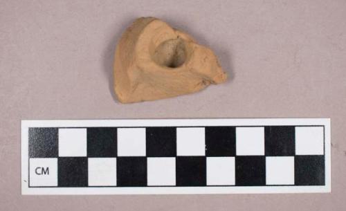 Ceramic, earthenware, molded redware fragment with partial perforation