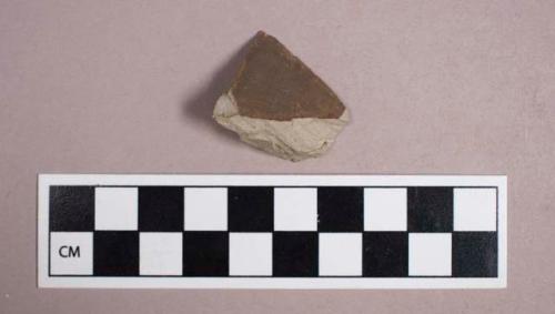 Ceramic, earthenware, brown slip glazed stoneware body sherd, possible ink master fragment